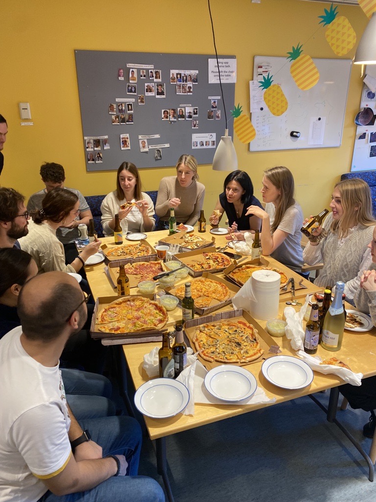 Group get together with pizza.
